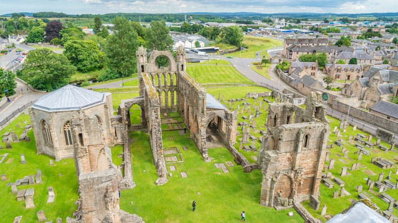 Aerial view of Elgin Cathedral, with a view of Old Town Elgin in the background, Scotland