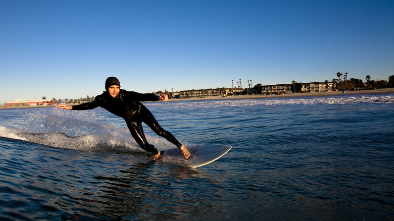 A surfer with a view of the beach