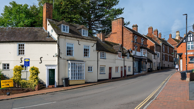 A row of homes and storefronts in the quaint British town of Market Drayton.