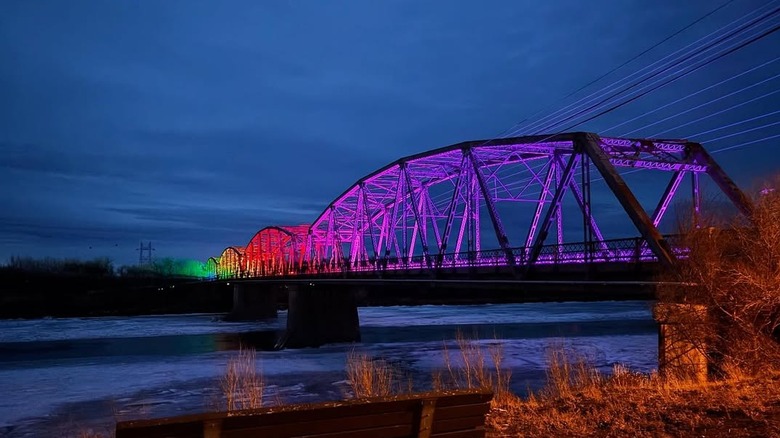 The Bell Street Bridge lit up like a rainbow in Glendive, Montana