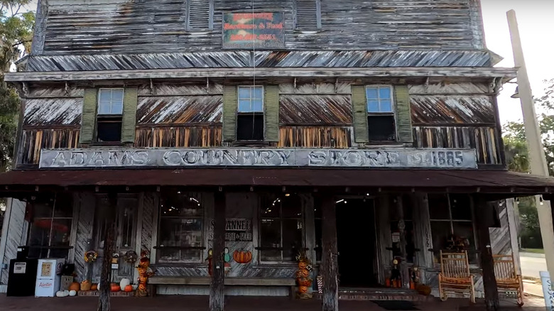 An old building with a sign that says "Adams Country Store" above the entrance