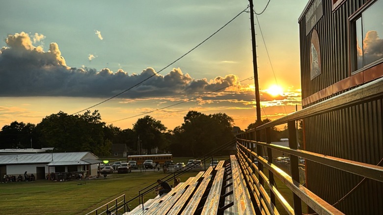 Sunset over metal bleachers at a local sports field in Gravette, Arkansas