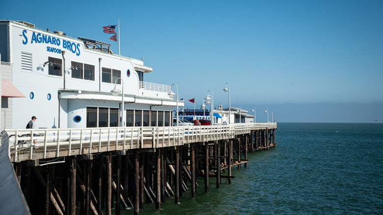Stagnaro Bros' white building overlooking the ocean at the end of the Santa Cruz Municipal Wharf.