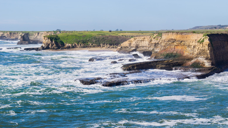 Waves crash against the cliffs at high tide at Wilder Ranch State Park, in Santa Cruz.