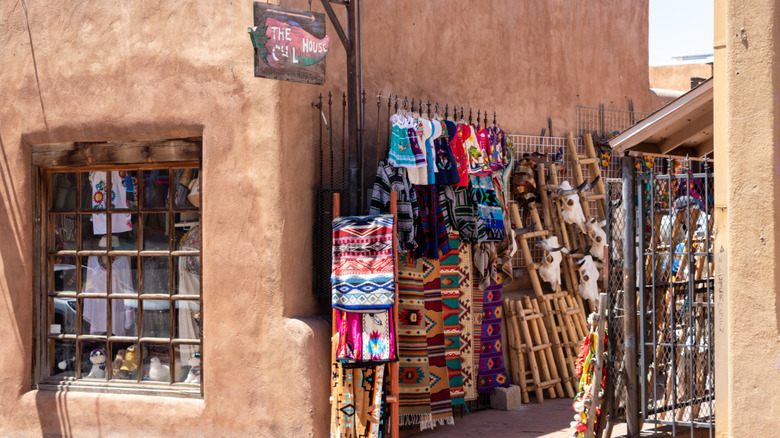 a store in Santa Fe with textiles hanging outside