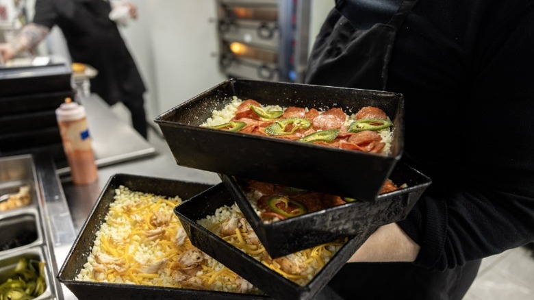 Gourmet Detroit-style pizza in the kitchen at Michigan & Trumbull in Corktown, Detroit.