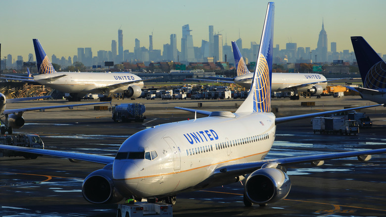 United airplane on runway in front of New York City skyline