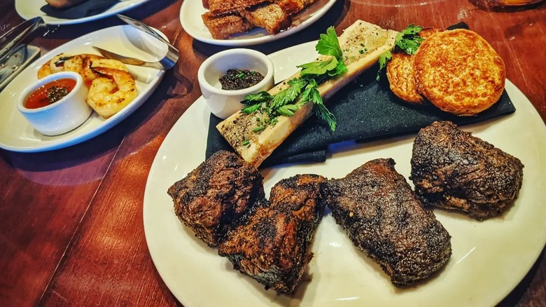 Platter with four steaks and bone marrow at The Butcher's Table in Seattle