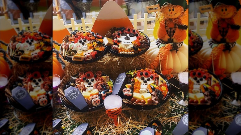 Assorted Halloween sweets, with pumpkins and a scarecrow