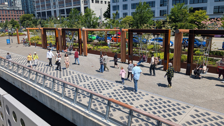 People strolling on the art-lined promenade of Seattle's Waterfront Park