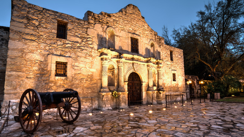 Lights illuminate the front wall of the Alamo in San Antonio, Texas