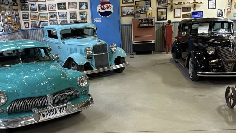 Three classic cars in a garage in Stanfield, Arizona