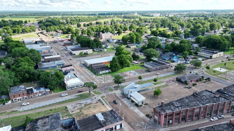 An aerial view of downtown Greenwood Mississippi's broad tree-dotted streets