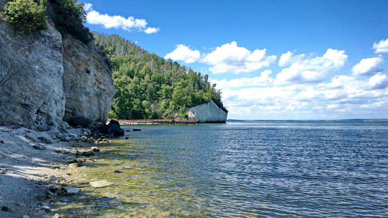 Limestone cliffs overlooking the lake, with a swimmable nook