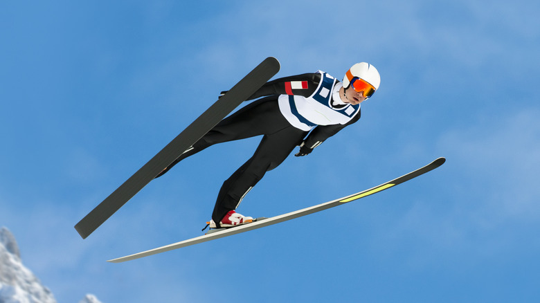 Person midair doing a ski jump