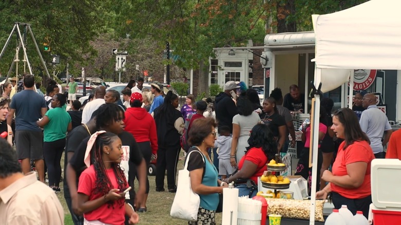 Shoppers at an open-air market in Shaker Square