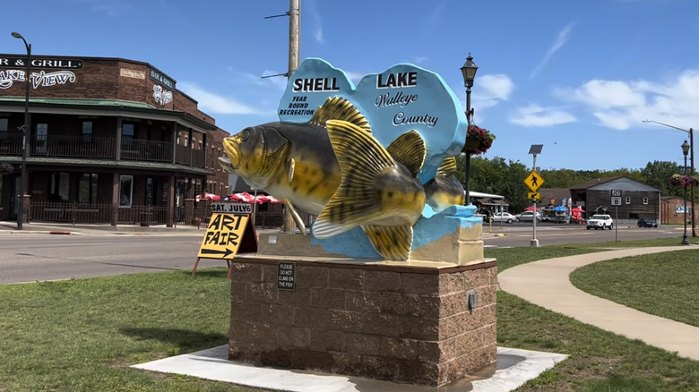 The Shell Lake, Wisconsin fish sign downtown with Lake View Bar & Grill in the background