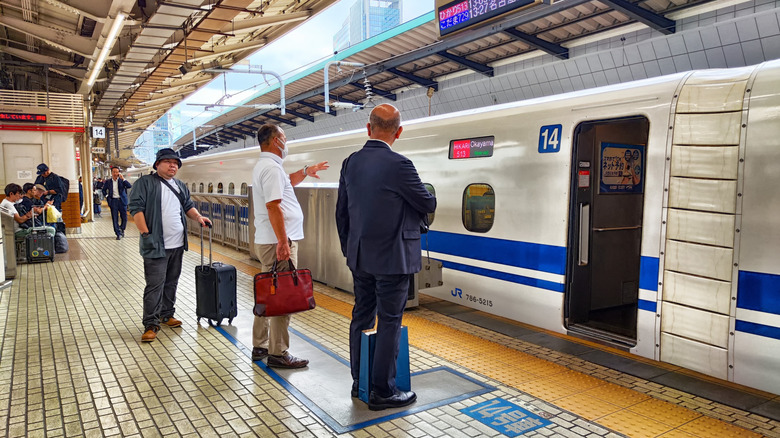Passengers waiting to board a Shinkansen