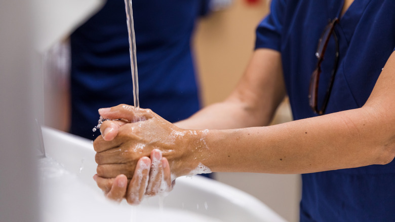 A woman washing hands