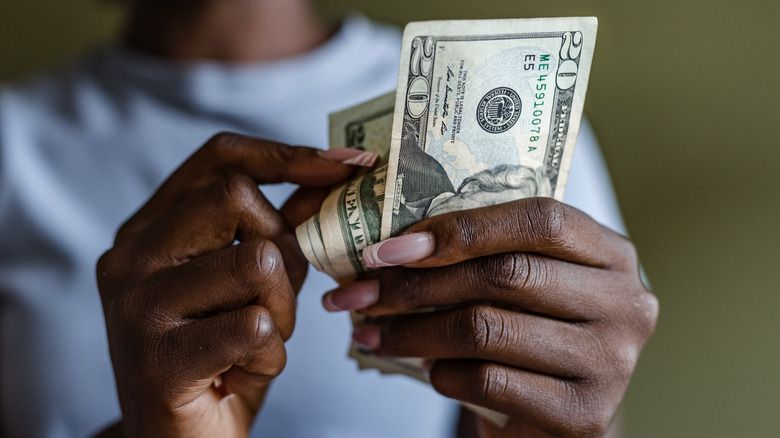 hands counting out cash