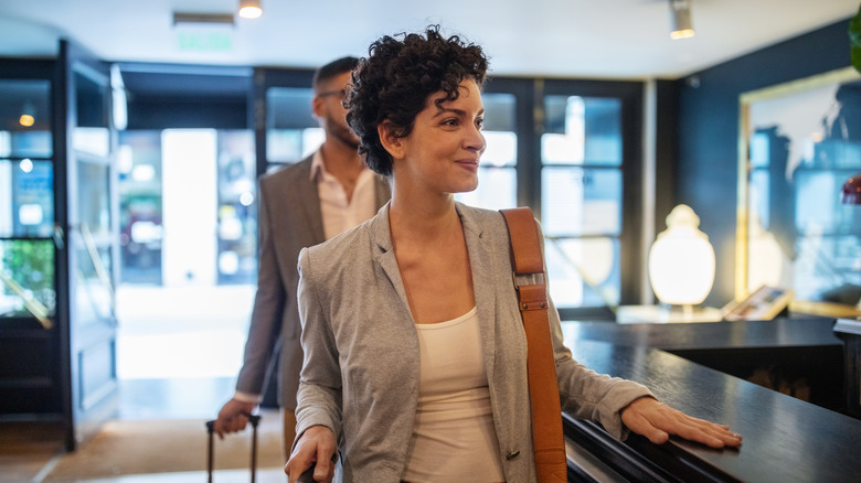 woman checking into hotel