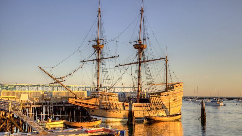 the Mayflower II in Plymouth Harbor bathed in light from sunset