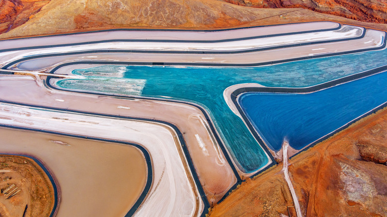 The potash ponds in the Utah desert during different stages of evaporation