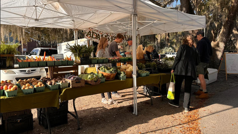 People browsing stands at a farmers market