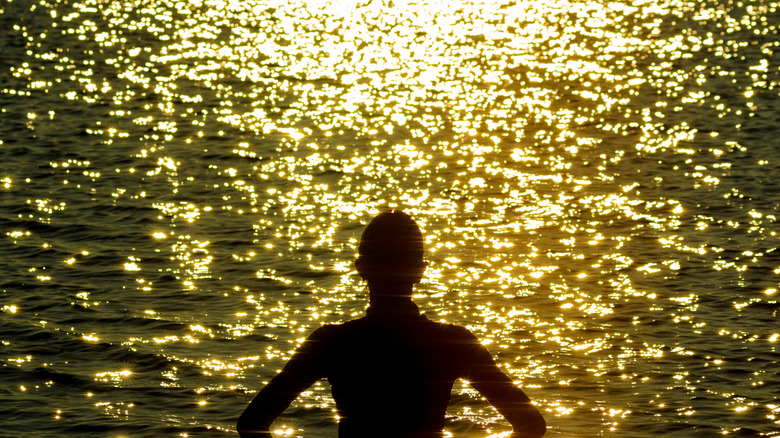 Woman standing in front of Lake Maxinkuckee in Culver, Indiana