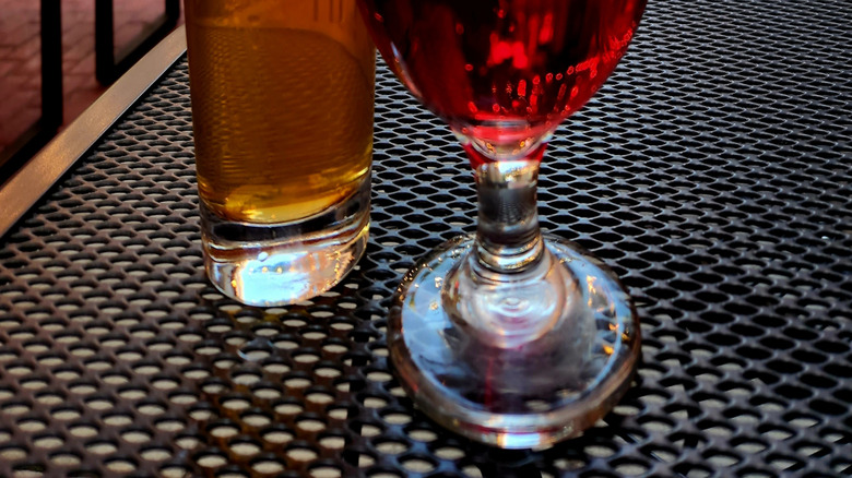 Two drinks on an outdoor patio table