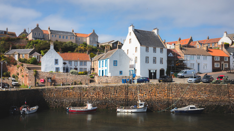 Fishing boats in harbor in Crail