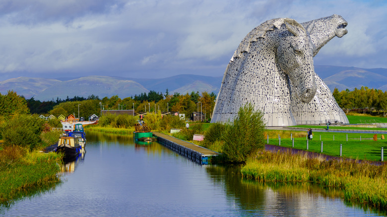 The Kelpies, giant horse statues, looming over a canal in central Scotland