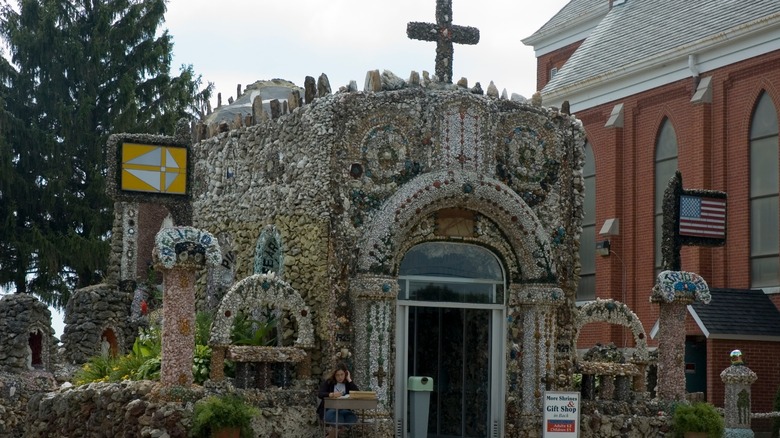 A small building covered in eclectic mosaic artwork at the Holy Ghost Parish