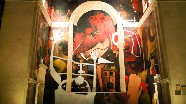 Inside the Iglesias de San Juan Bautista with the murals of Alarcón