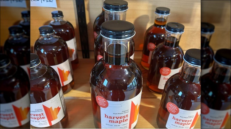 Maple syrup bottles for sale on a shelf