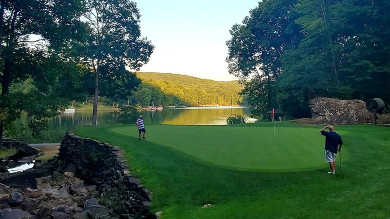 Golfers assess their lay at Stonehenge Golf Course