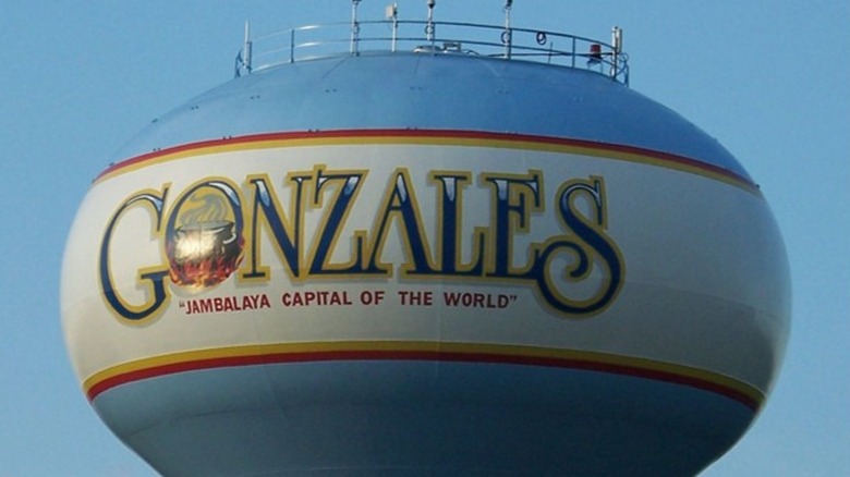 Water tower with a sign saying Gonzales, Jambalaya Capital of the World