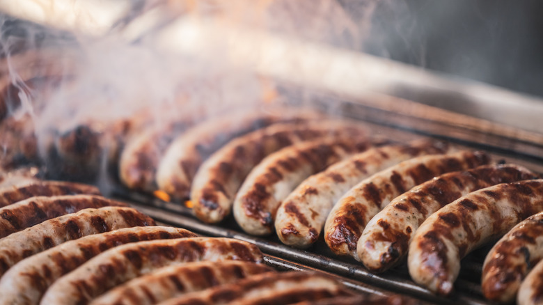 German sausages cooking on a grill