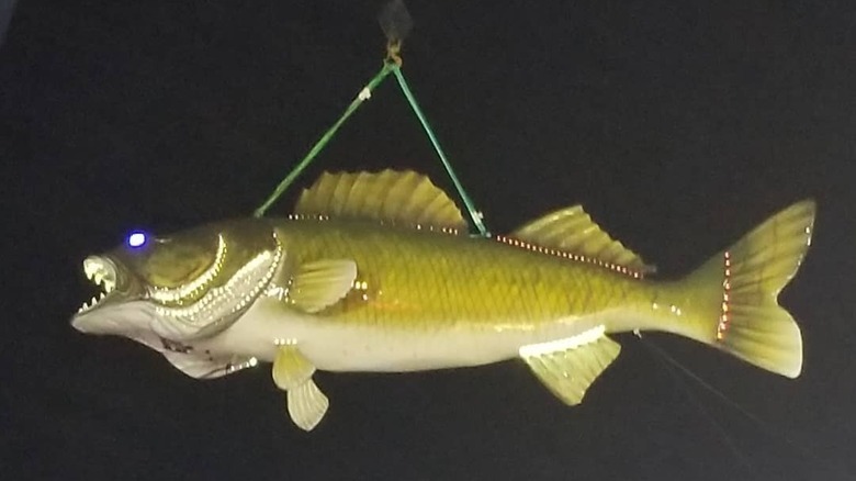 fiberglass walleye hanging from pulley