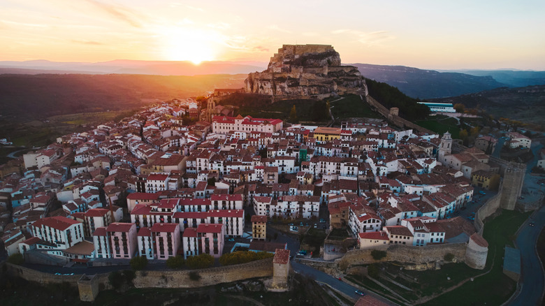 Aerial view of Morella at sunset with the castle dominating the landscape