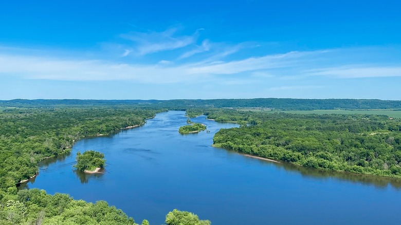 River, trees, and blue sky