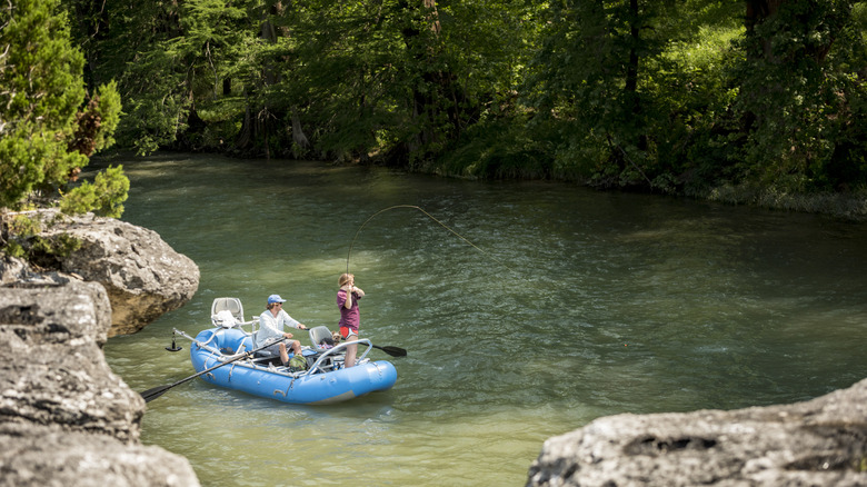 Family fishing in a stream