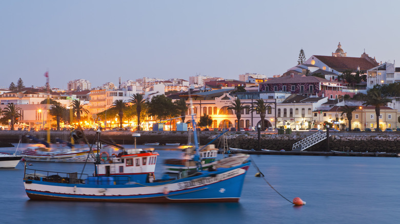 Boats in Lagos Marina with old town buildings in the background