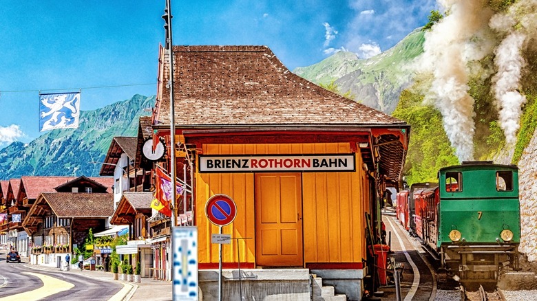 View of Brienz station, the first station of the Brienz Rothorn railway, a historic steam train that goes through the Emmental Alps in the Bernese Oberland region of Switzerland, pictured here on a bright, sunny day