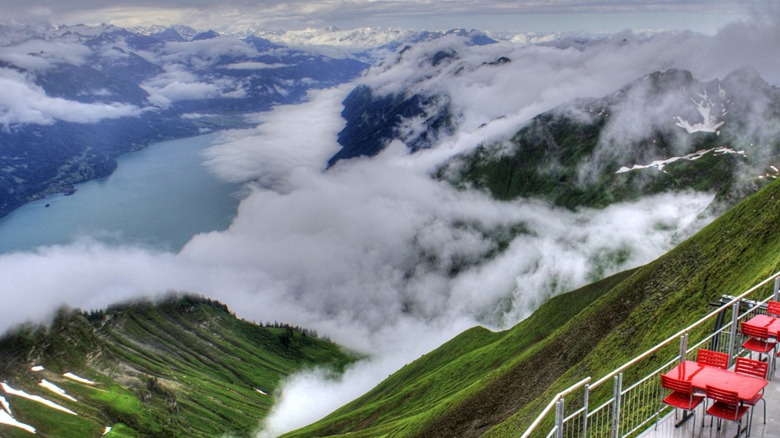 View of the Swiss Alps, Lake Brienz, and the Bernese Oberland in Switzerland, seen from the Berghaus Rothorn Kulm hotel near the summit of Brienzer Rothorn