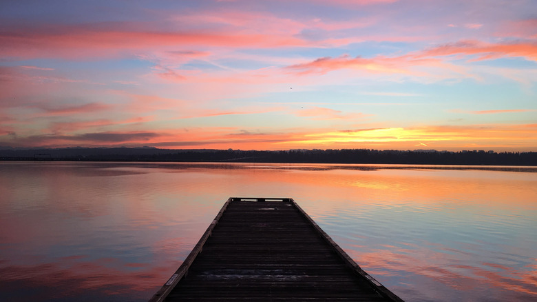 Sunrise in Seattle's Madison Park neighborhood overlooking Lake Washington from a dock