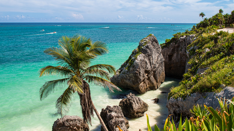 Turquoise ocean and rock formations in Tulum