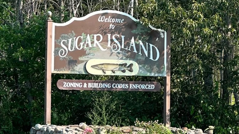 A sign reading Welcome to Sugar Island