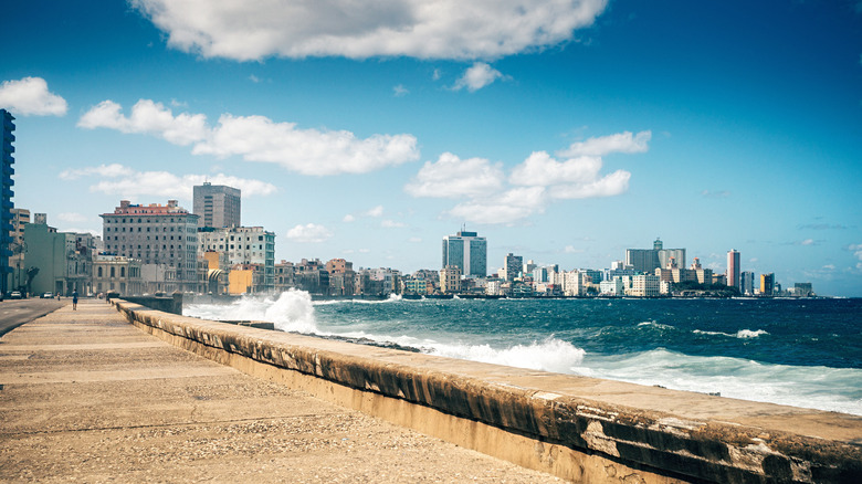 Waves crash against the seawall of Malécon in Havana