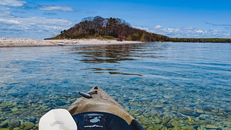 A sandy beach on Chambers Island, Wisconsin, from a kayak.